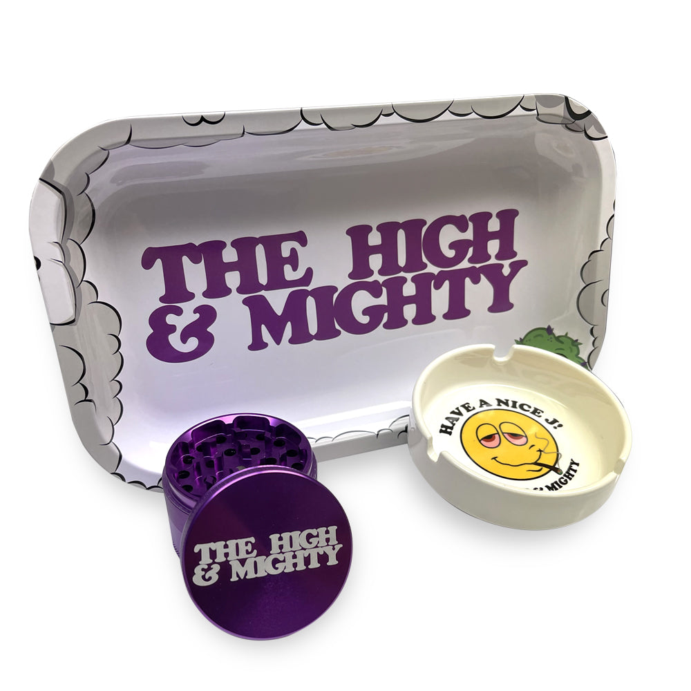 picture of white metal tray that reads the high & mighty, purple metal grinder and white ashtray