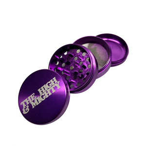 purple metal grinder with white the high & mighty on top